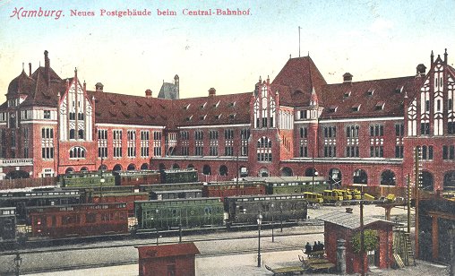 The coloured postcard shows the mail railway sidings and the building of the Main Post Office 1